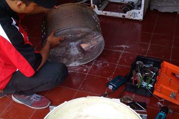 Proses perbaikan mesin cuci