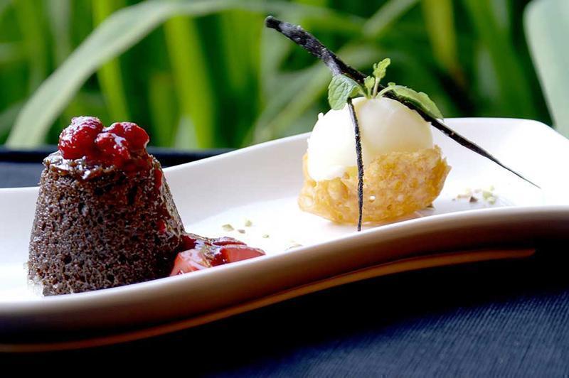 Lava cake spiced belgian soft centred pudding berry crush vanilla bean ice cream
